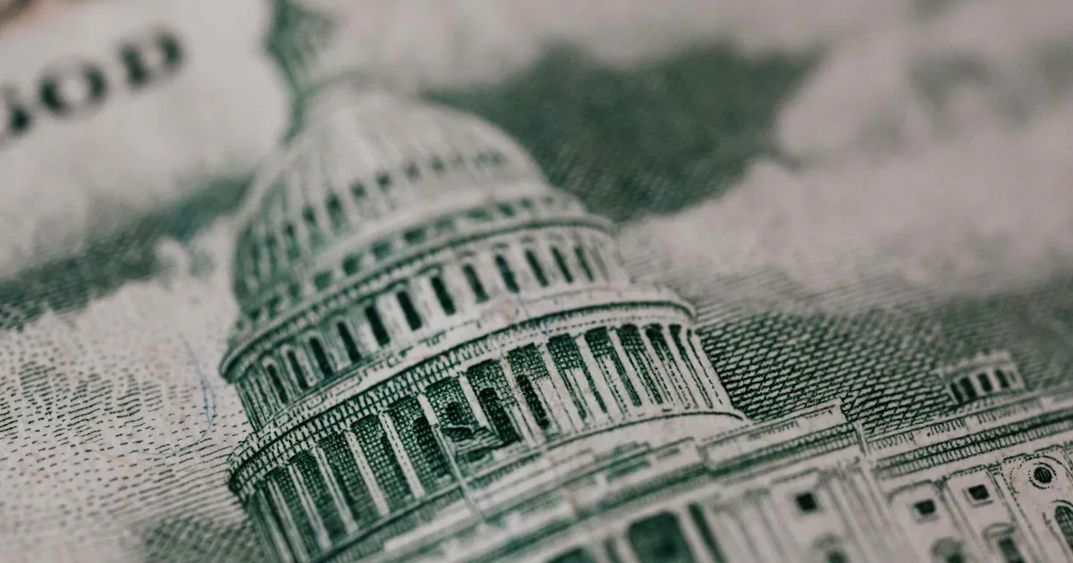 Déficit nas contas públicas: Ilustração do Capitólio dos EUA em nota, representando os desafios fiscais do governo.